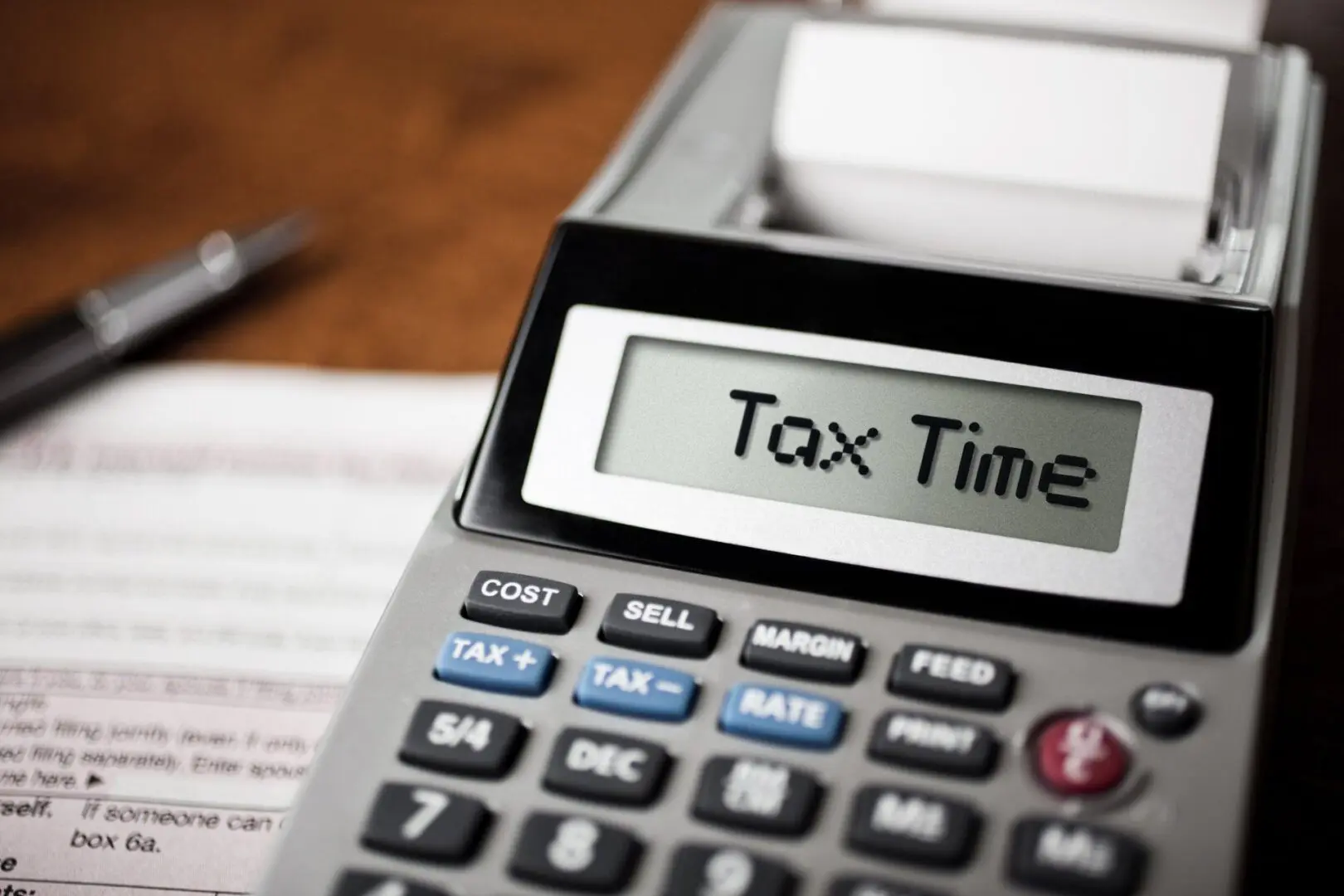 Financial calculator showing tax reminder